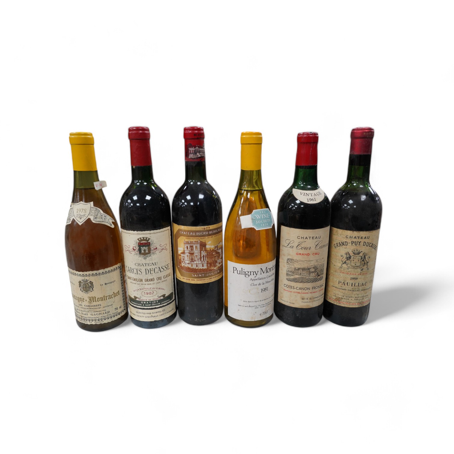 Six bottles of mixed wines: Chateau Ducru-Beaucaillow Saint Julien 1977, Grand-Puy Ducasse Pauillac 1959, Chateau Larcis Ducasse Saint-Emilion Grand Cru, 1982 and three other wines